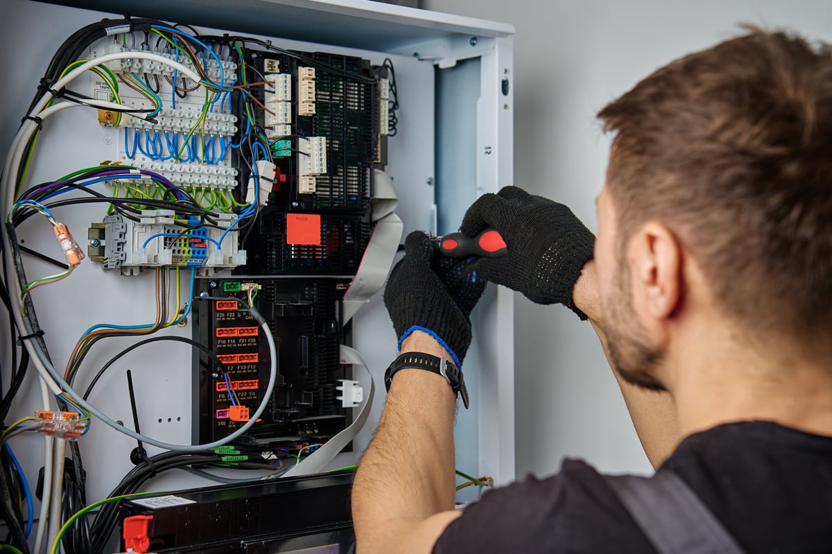 Electrician working on home renovation electrical project